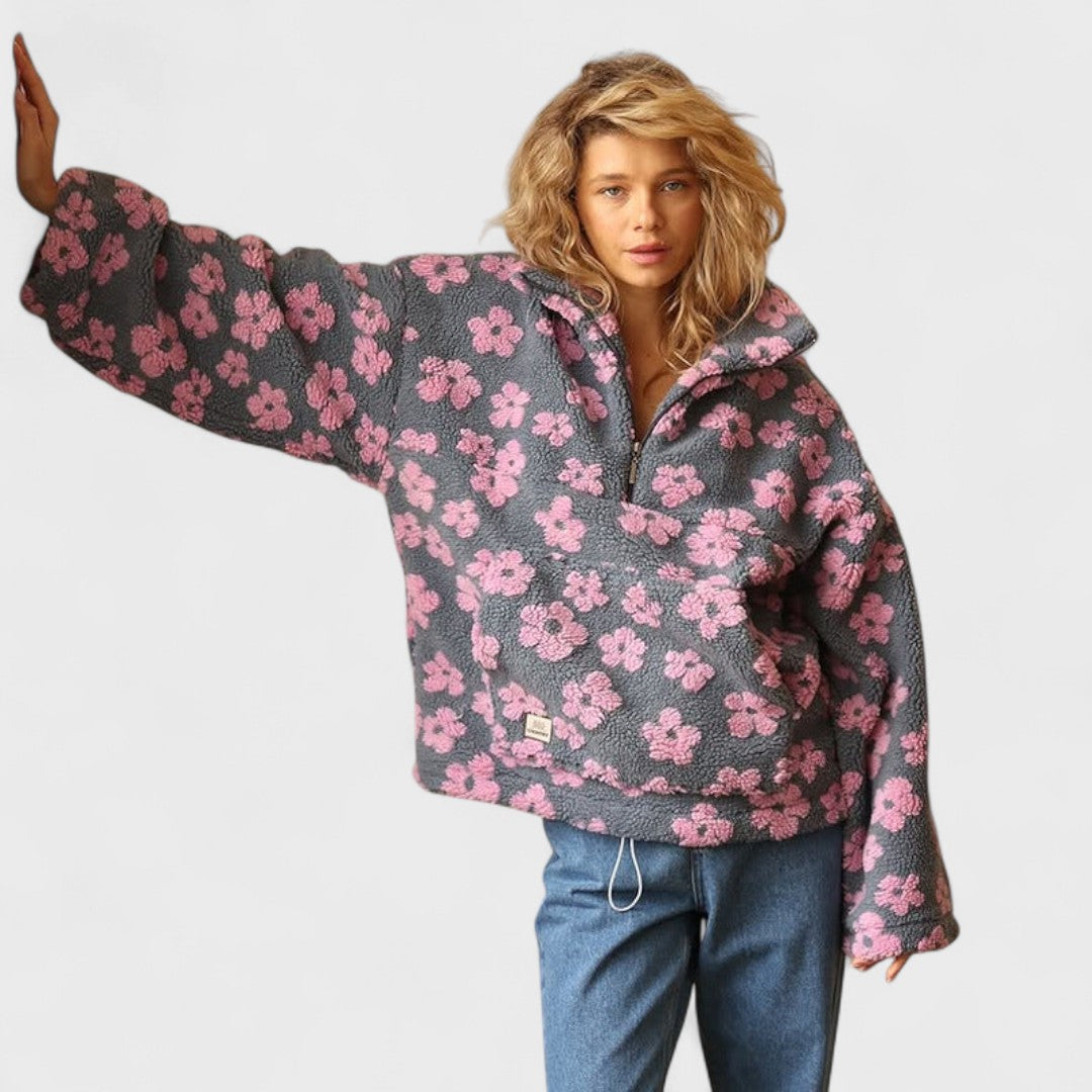 Front view of a women's floral print polar fleece pullover, winter fashion