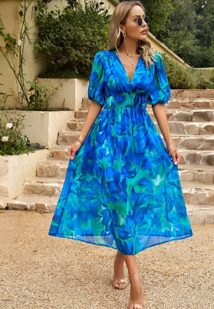 Stylish women's floral V-neck midi dress with puff sleeves, perfect for summer elegance.