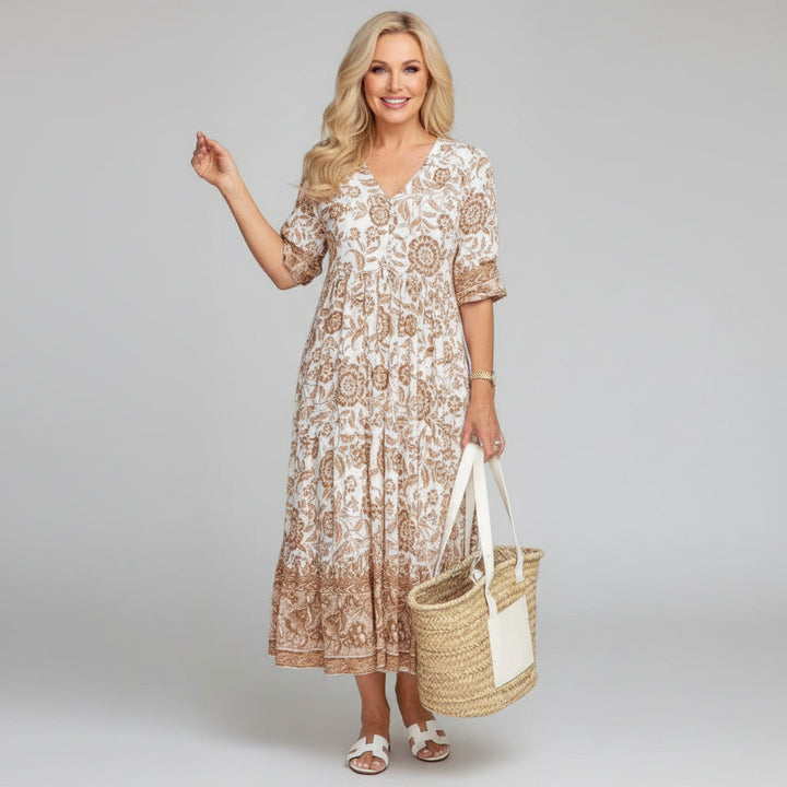Flowy women's floral midi dress, tiered design, ideal elegant summer vacation or party wear.