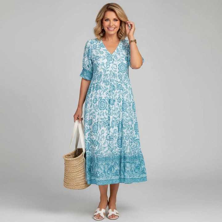 Beautiful women's floral tiered midi dress, V-neck, 3/4 sleeves, a stylish choice for summer parties.