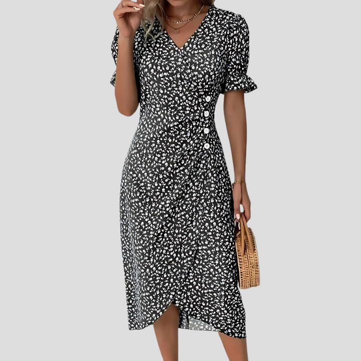 A-line floral midi dress for women featuring a stylish V-neck and trendy puff sleeves