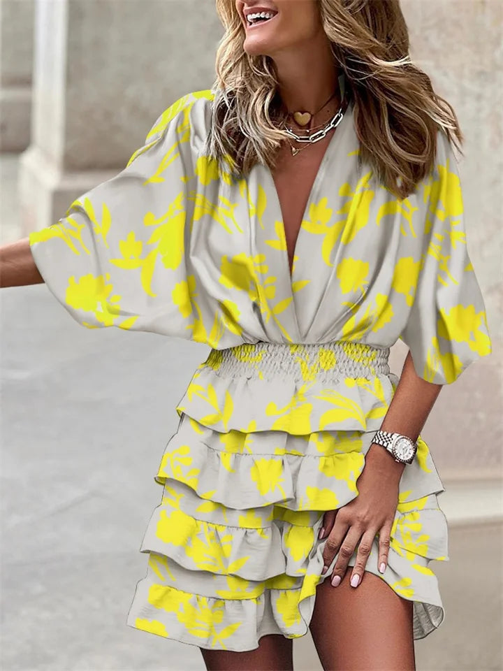 Women's floral V-neck mini dress with elegant ruffles & batwing sleeves, perfect for spring/summer casual wear.