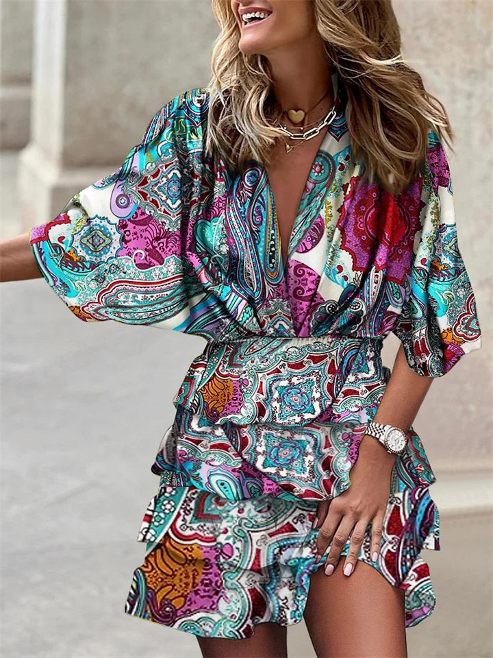 Elegant floral mini dress for women, featuring a flattering V-neck, ruffles, and stylish batwing sleeves. Summer ready.