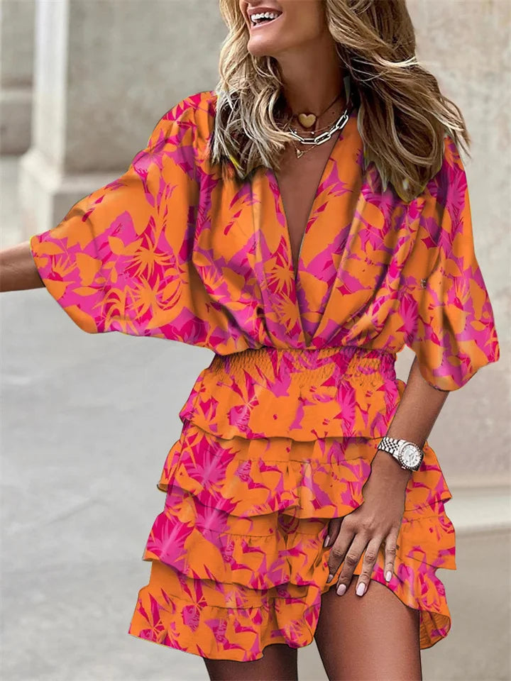 Casual yet elegant women's floral print V-neck mini dress with feminine ruffles & flowy batwing sleeves. Spring outfit.