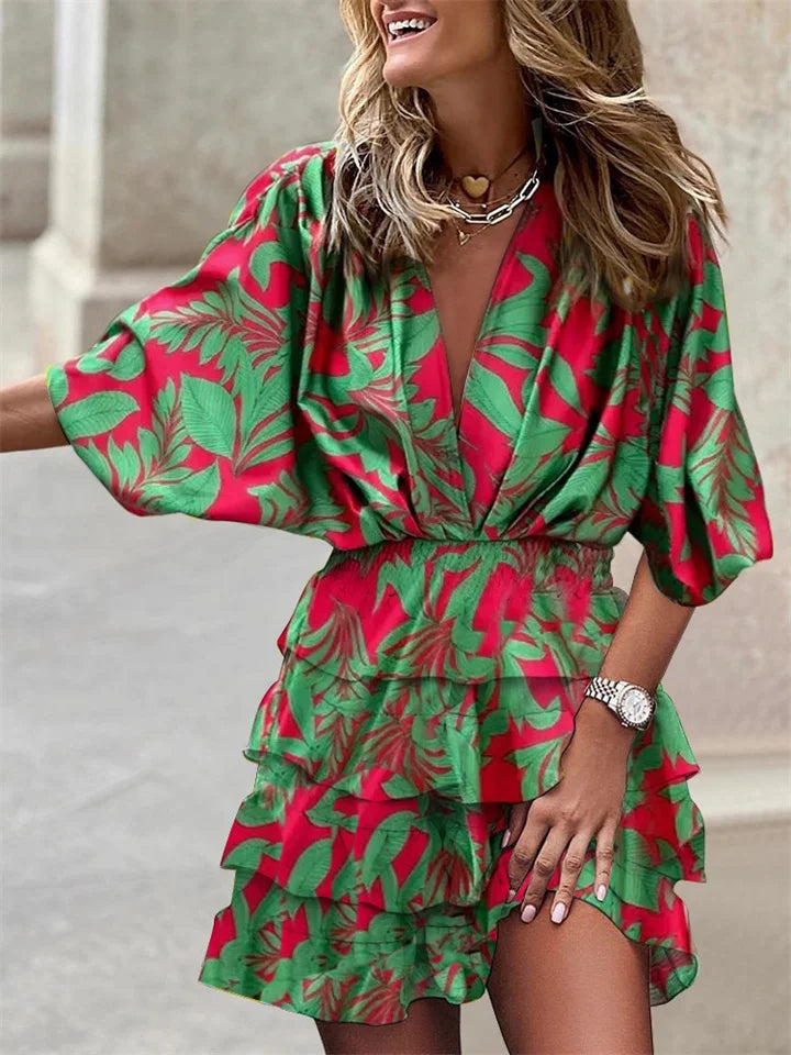 Flattering women's floral V-neck dress, mini length, with soft ruffles and relaxed batwing sleeves. Great for summer comfort.