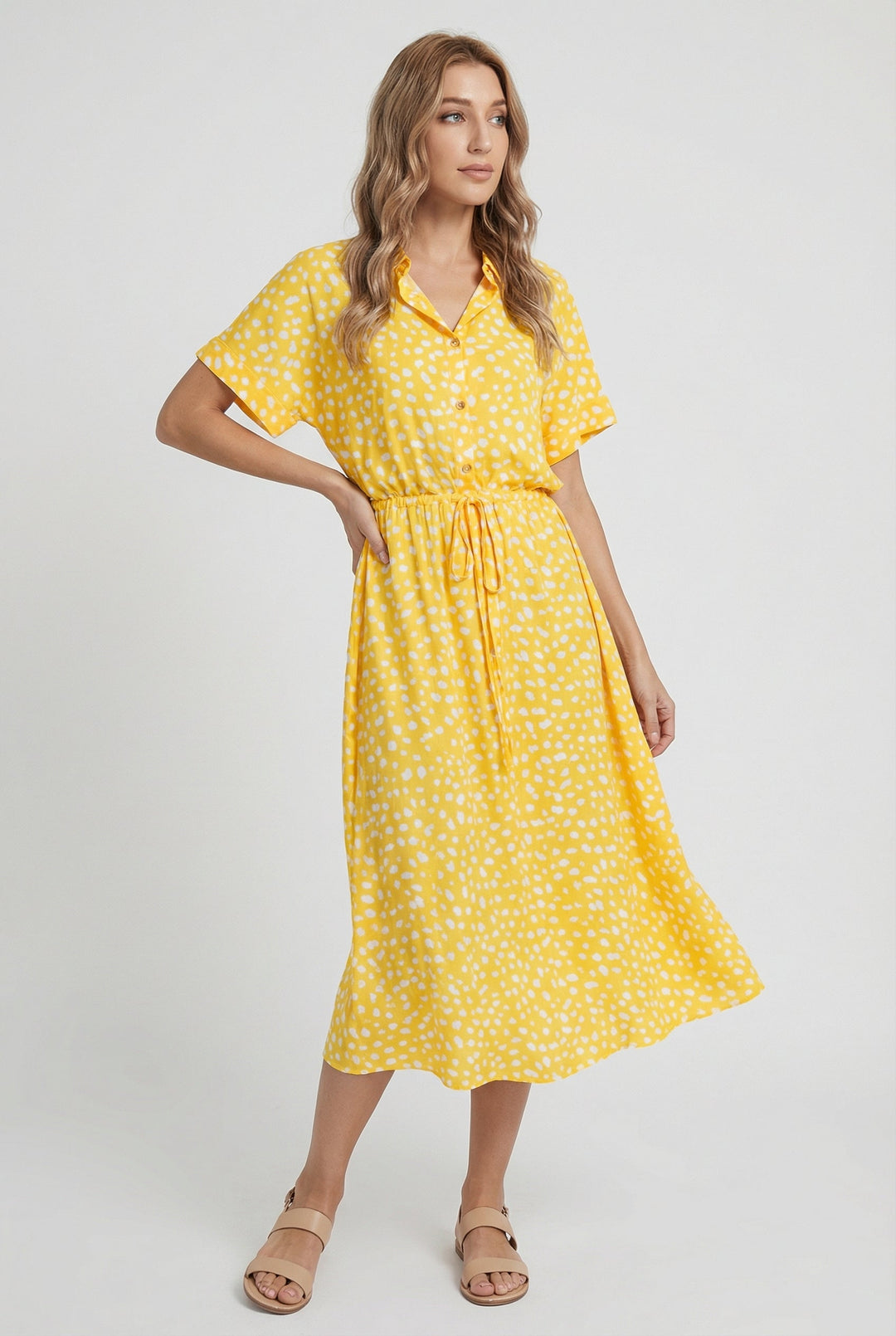 Lightweight women's floral summer midi dress with a gathered waistband and practical short sleeves.