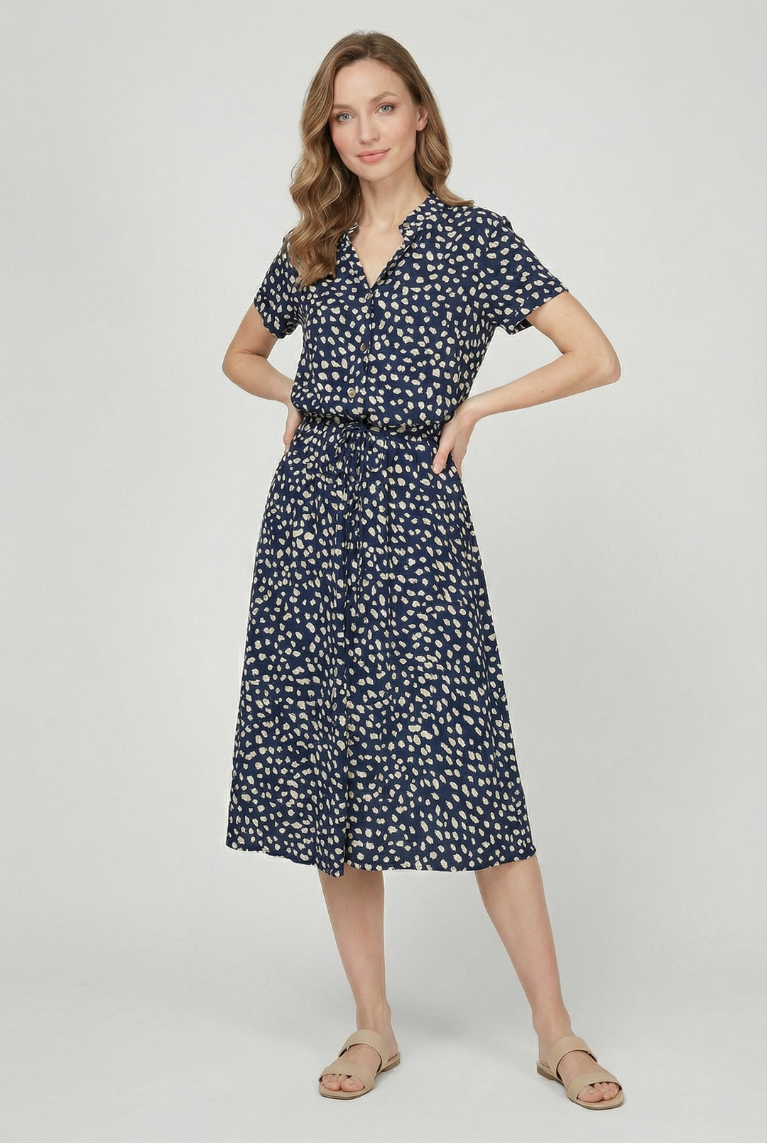 Beautiful women's floral midi dress featuring a flattering waistband and turn-down collar, summer ready.