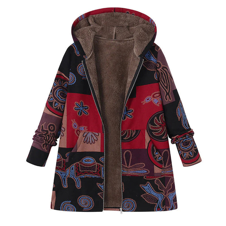 Model smiling while wearing a comfortable women's floral hooded winter coat, ideal for outdoor warmth.