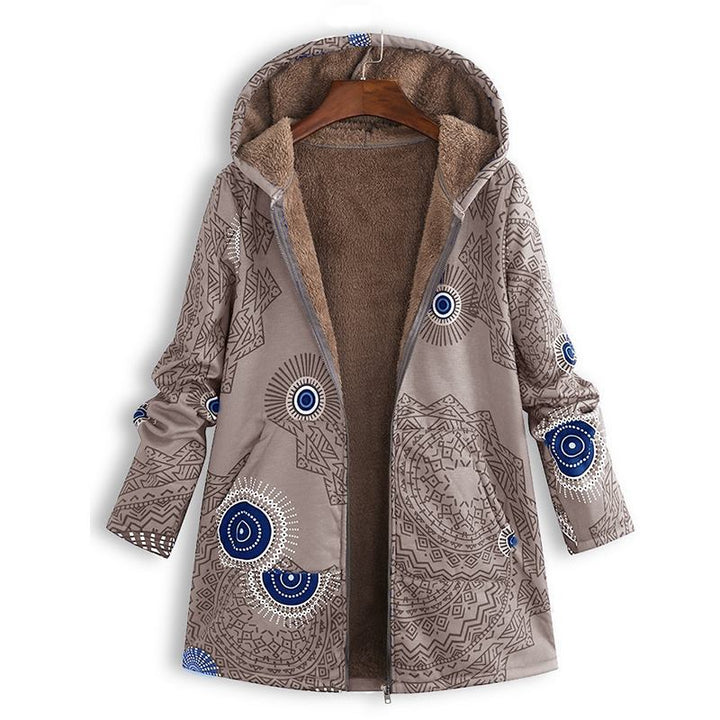 Close-up of the zipper and durable fabric of a women's hooded floral winter jacket, built for warmth.