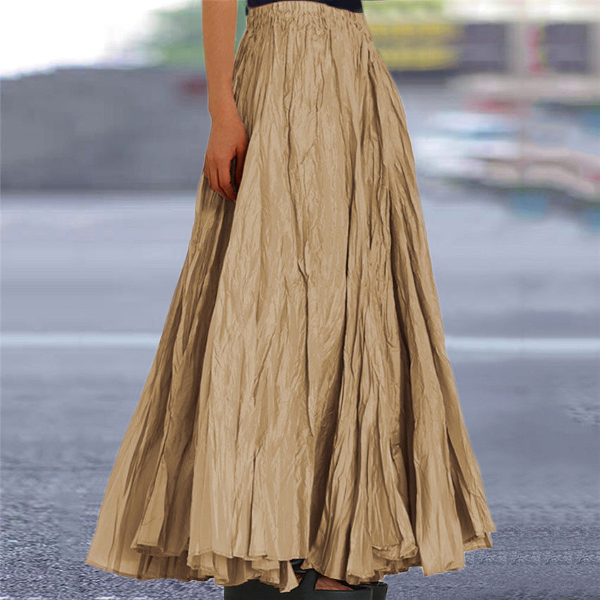 Women's flowing black maxi skirt with elastic waistband, perfect for elegant everyday wear.