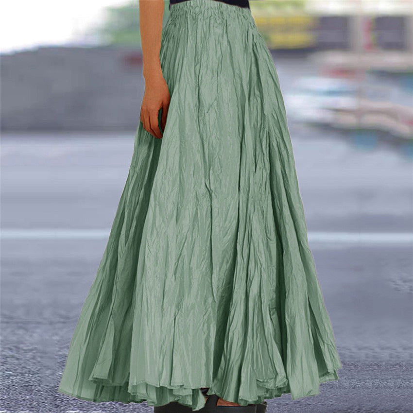 Stylish navy blue pleated women's maxi skirt, offering an elastic waist and versatile fashion.