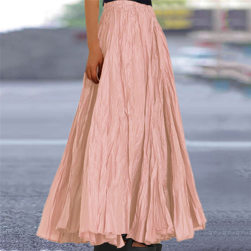 White flowy long skirt with an elastic waist, essential for women's everyday elegance and comfort.