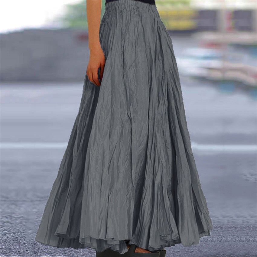 Green versatile women's long skirt, featuring a comfortable elastic waist and flowing silhouette.