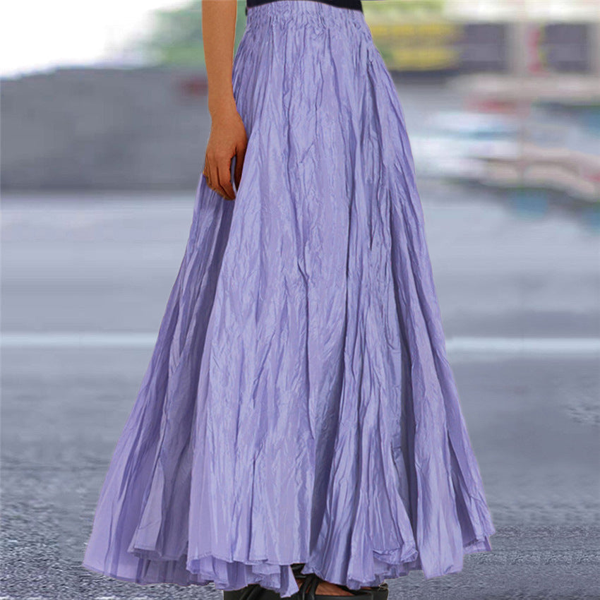 Navy blue flowy pleated maxi skirt for women, featuring an elastic waist for a perfect fit.