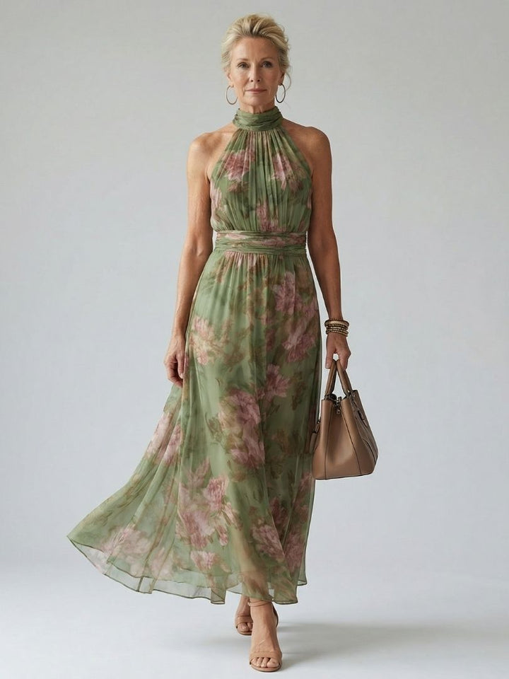 Women's flowy sage green halter midi dress with gathered details, perfect for summer vacation.