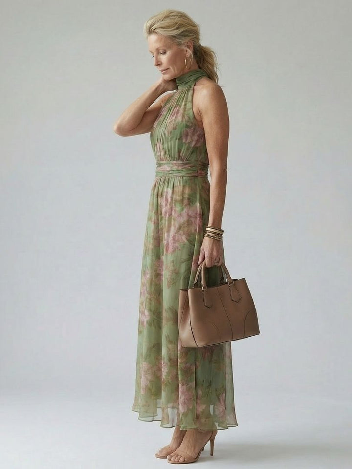 Sage green floral flowy midi dress with a stylish halter neckline, a chic summer vacation outfit.