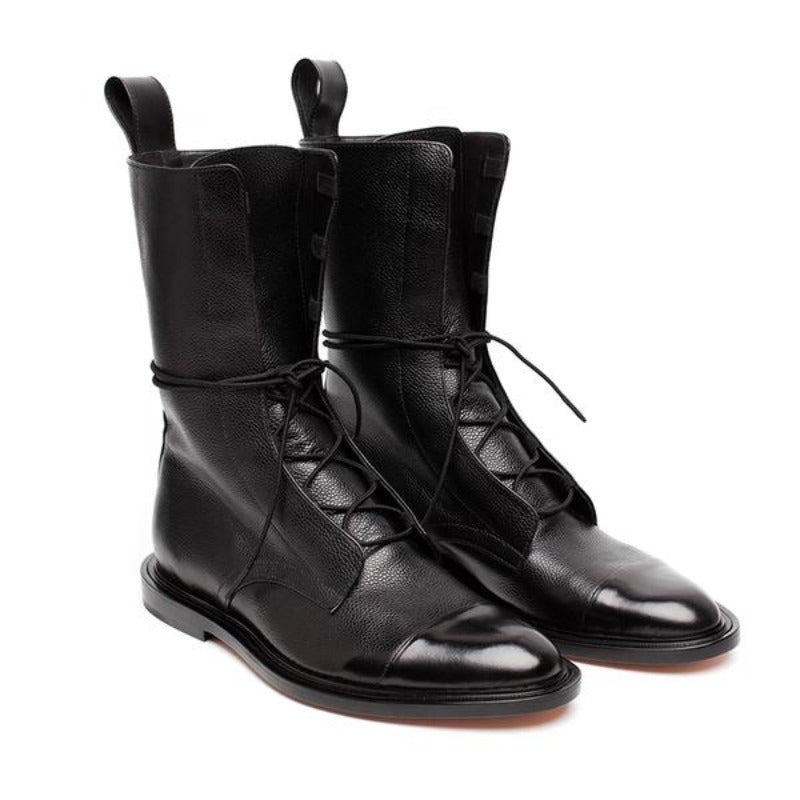 Women's formal black lace-up ankle boots with elegant design and sturdy heel, perfect for sophisticated occasions.