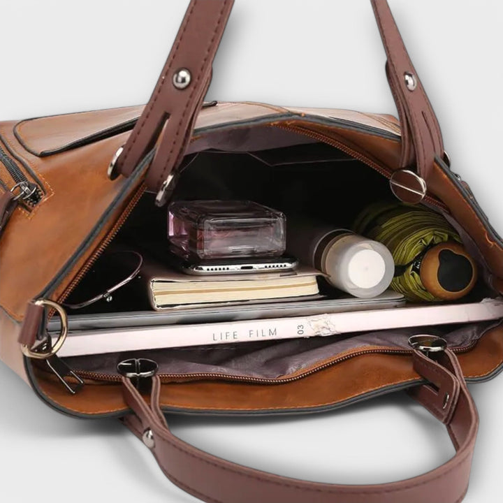 Practical women's functional shoulder handbag, offering ample storage with its multi-pocket design.
