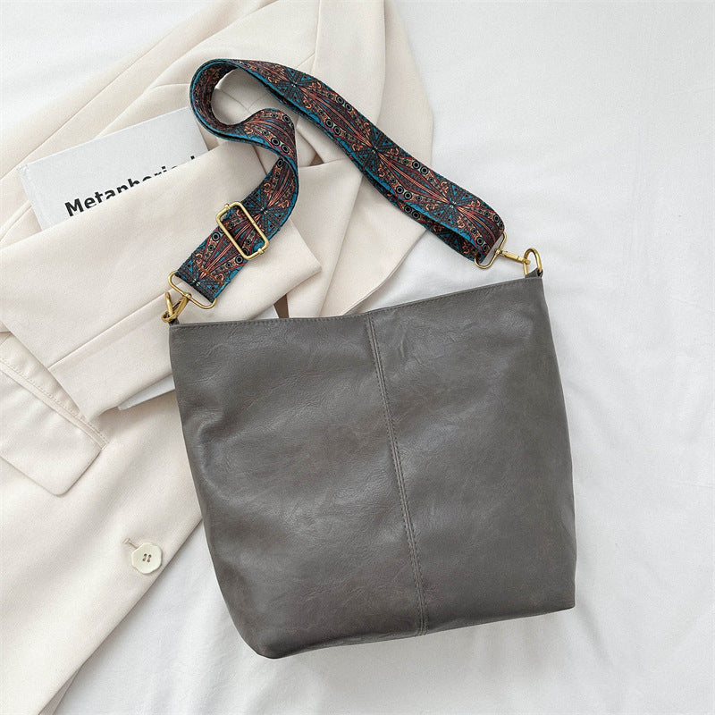 Back view of women's genuine leather hobo crossbody bag, plain and elegant design