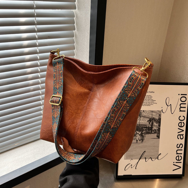 Elegant genuine leather hobo crossbody bag for women, an essential fashion accessory