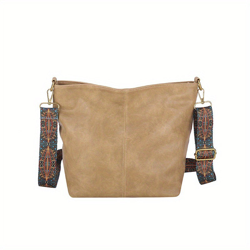 Women's hobo bag in soft leather, worn as a shoulder bag, showing its comfortable fit