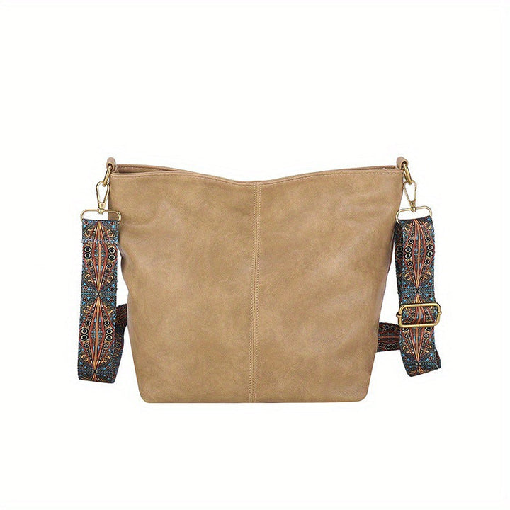 Women's hobo bag in soft leather, worn as a shoulder bag, showing its comfortable fit