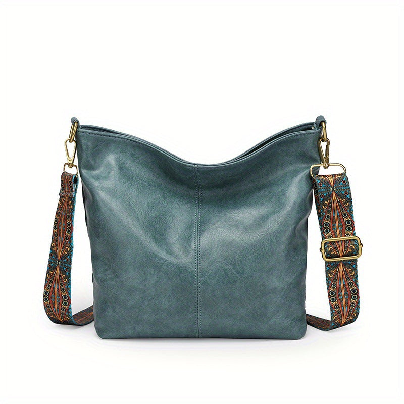 Detail of the zipper and hardware on a new women's leather hobo handbag