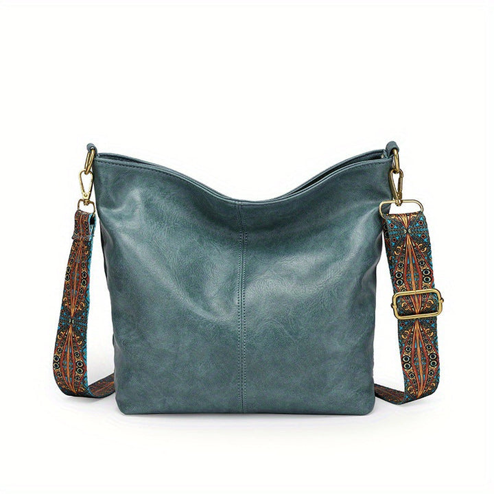 Detail of the zipper and hardware on a new women's leather hobo handbag