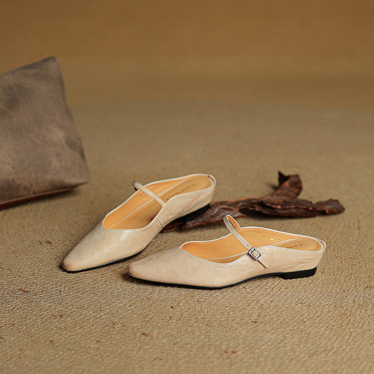 Close-up of women's leather slip-on mules, showcasing genuine leather craftsmanship