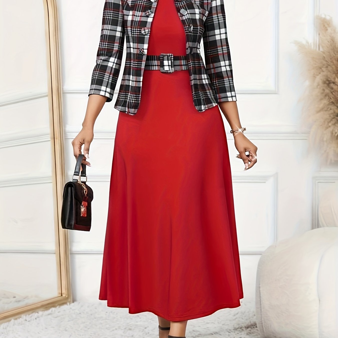 Focus on the unique geometric print of the women's two-piece dress and jacket set.