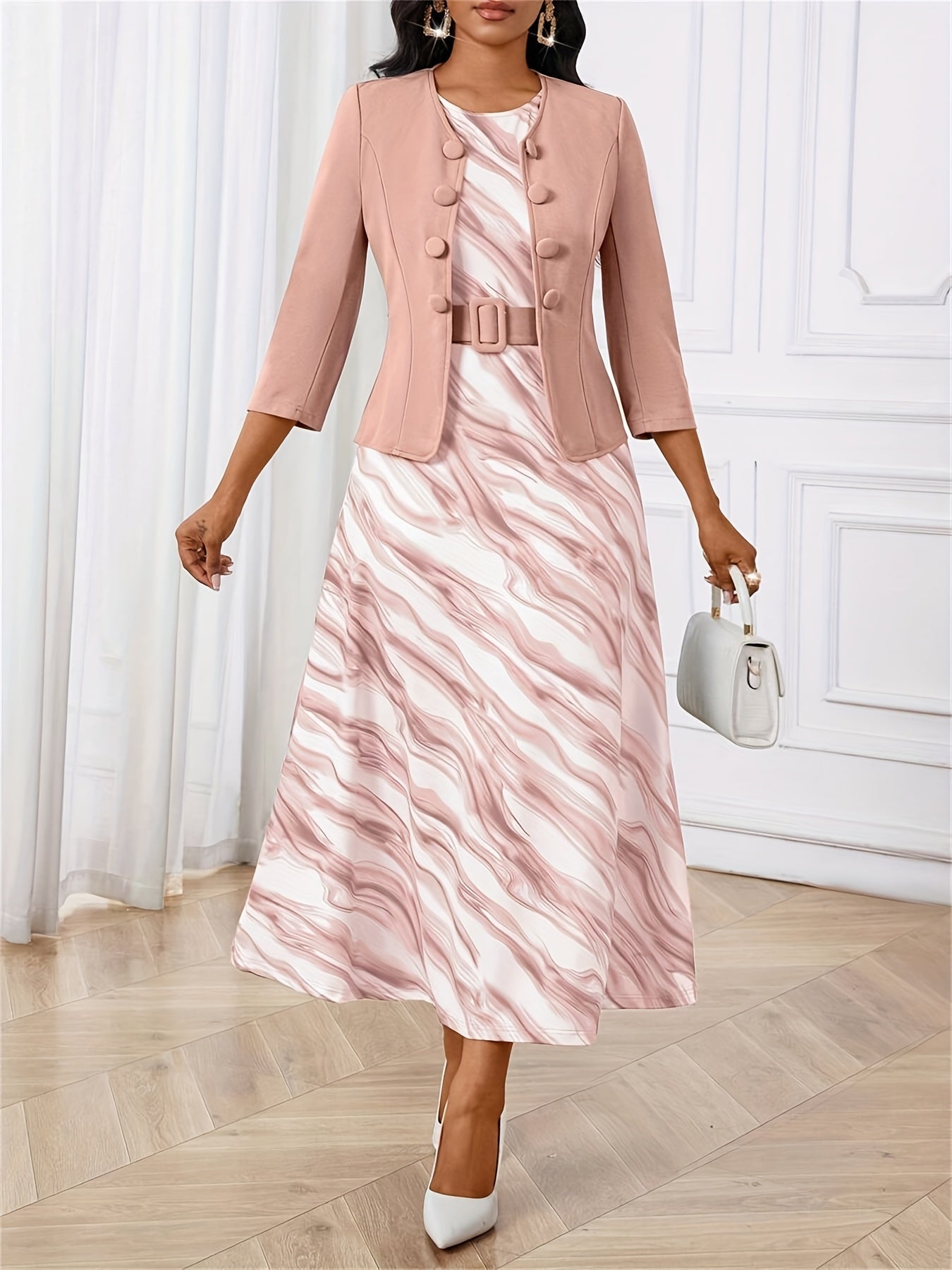 Detail of the belt on a women's printed two-piece dress and jacket set, defining the waist.