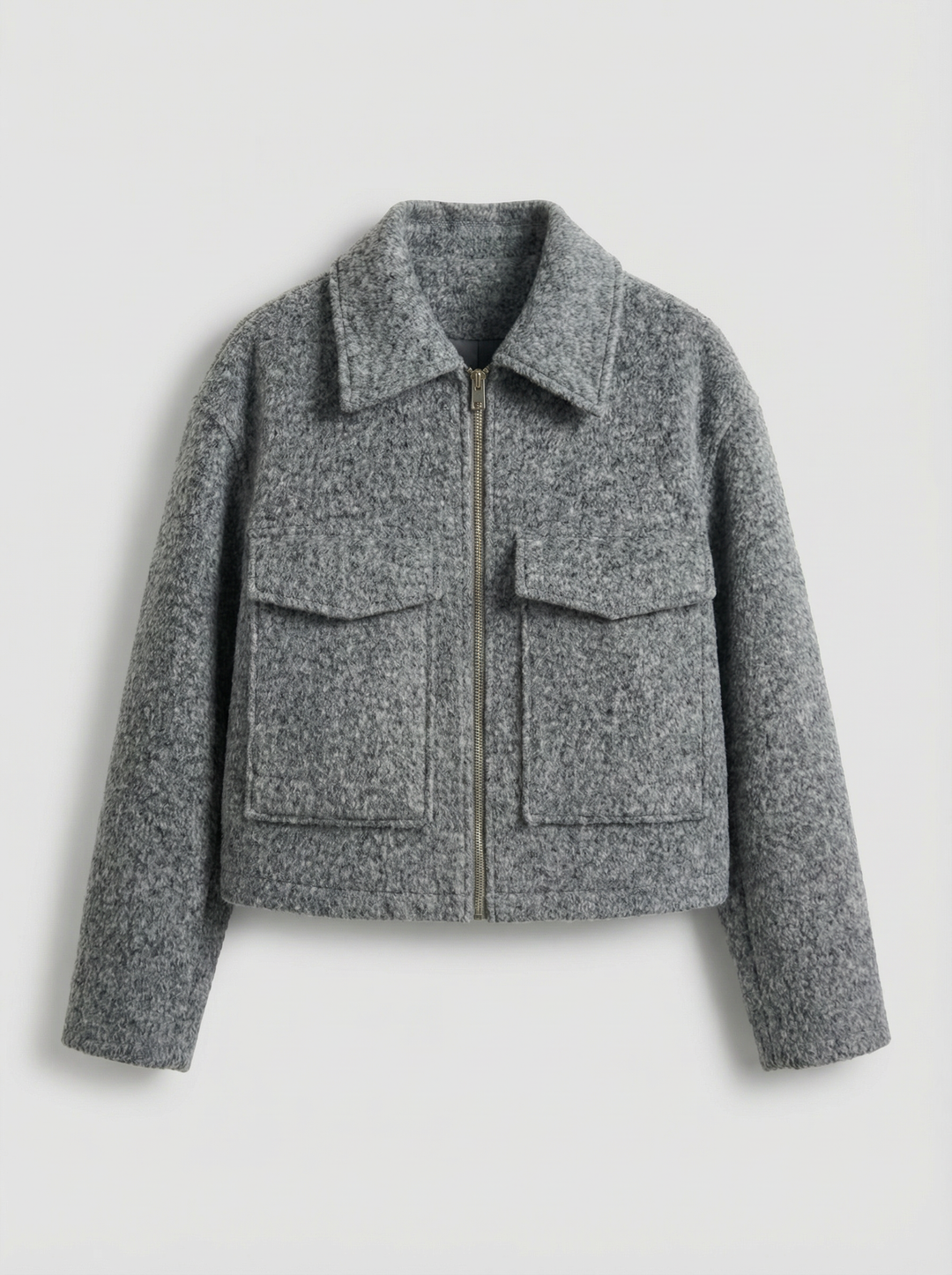 Modern gray cropped zip jacket for women, with practical front pockets. Great for stylish layering.