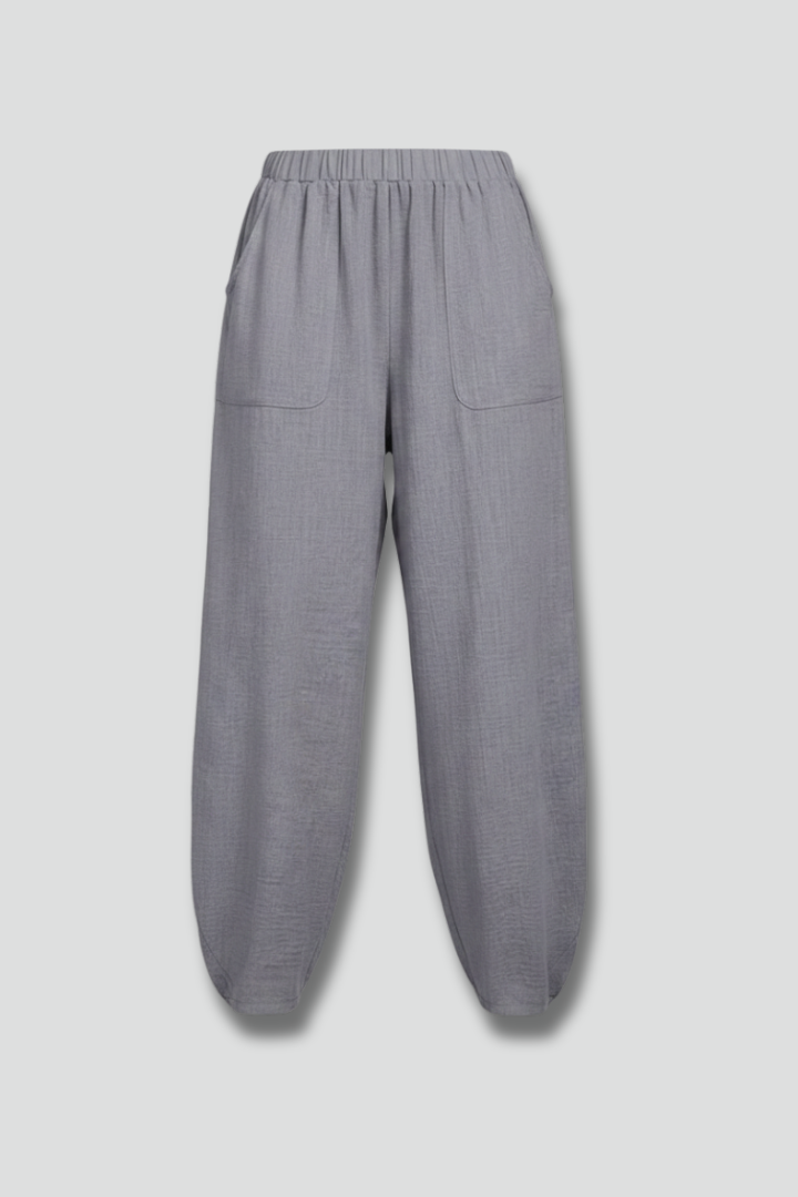 Women's grey elastic waist trousers with convenient side pockets, perfect for casual summer wear.