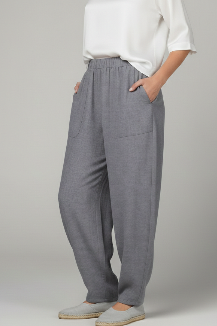 Stylish grey elastic waist women's trousers, offering a relaxed fit and handy side pockets.