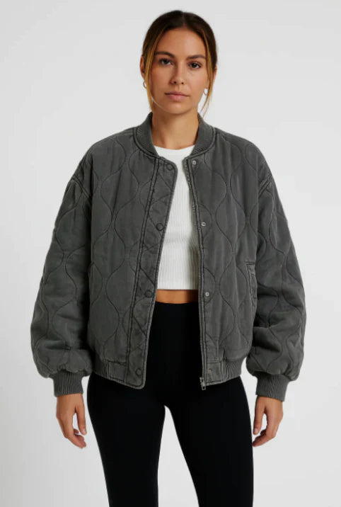 Women's grey quilted bomber jacket with zip closure, perfect for fall fashion outerwear
