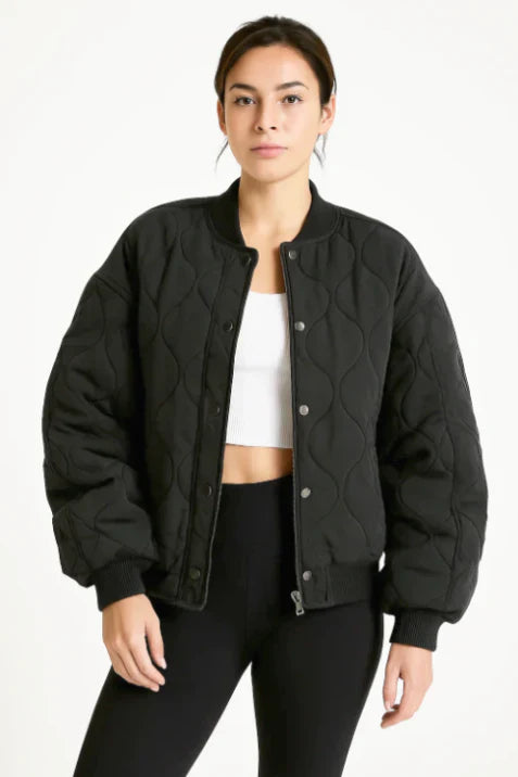 Stylish women's black quilted bomber jacket, a versatile casual zip-up for winter