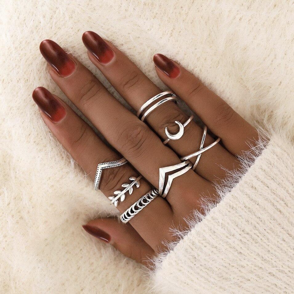 Crafted women's silver ring set, unique stackable designs. Elegant handmade jewelry for her.