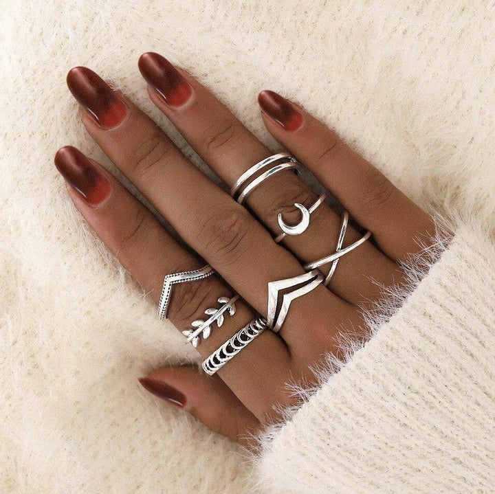 Crafted women's silver ring set, unique stackable designs. Elegant handmade jewelry for her.