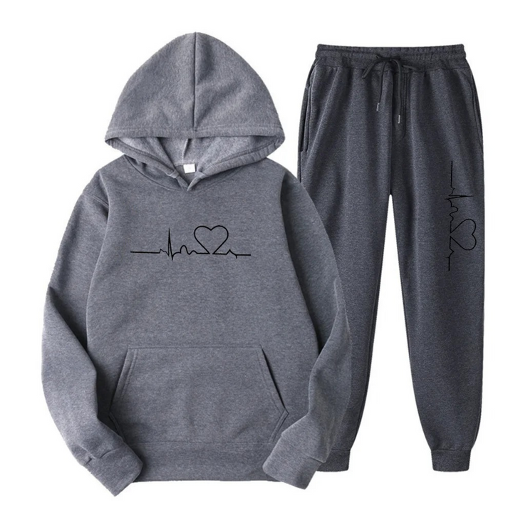 Comfortable women's loungewear set, black hoodie with white heartbeat graphic and matching joggers