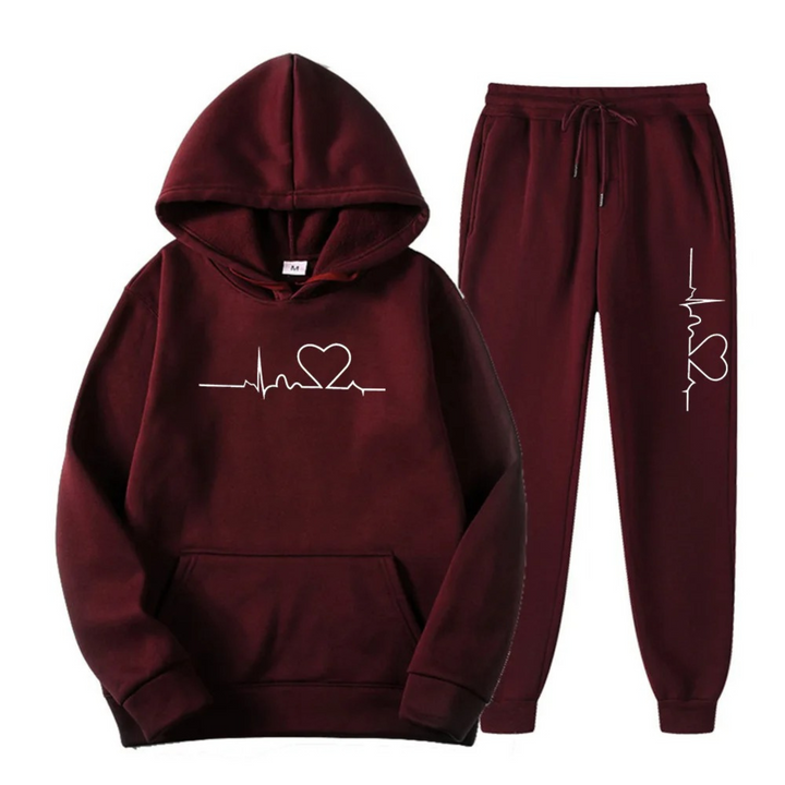 Stylish women's black loungewear set with a distinctive heartbeat graphic on the hoodie and pants