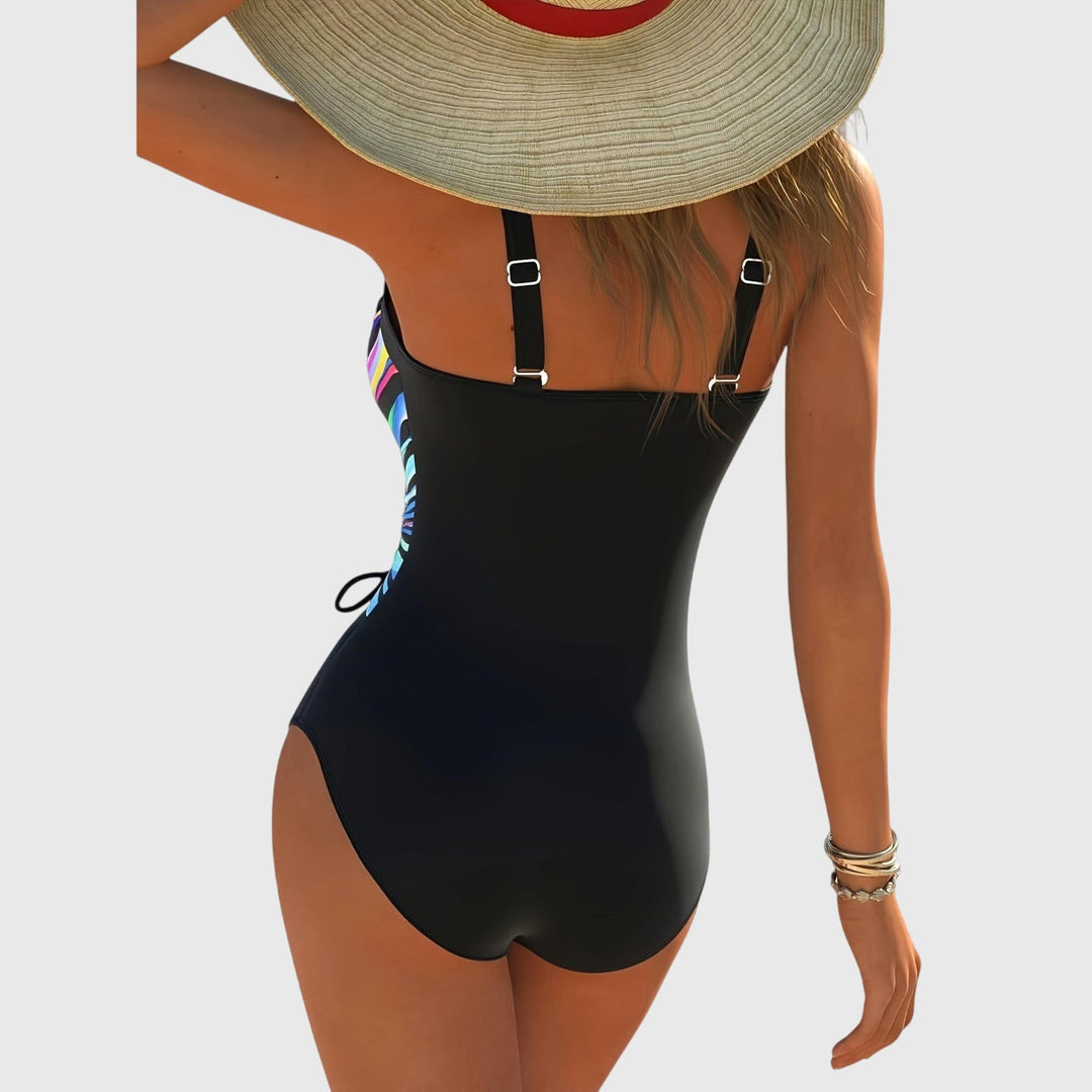 Fashionable women's swimwear with cross-front detail, high elasticity one-piece, ideal for beach and pool.