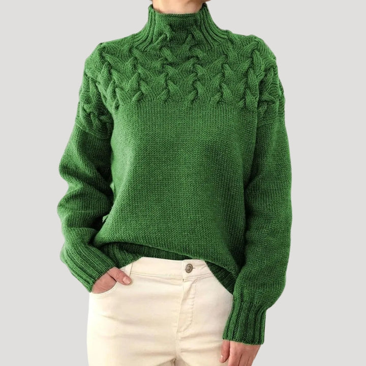 Women's high-neck cable knit spring sweater in a light color, perfect for casual elegant wear.