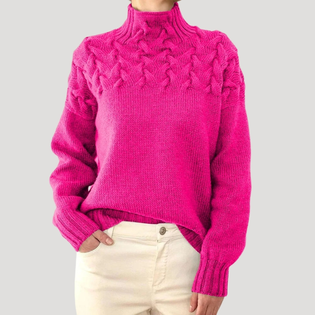 Casual yet chic women's spring sweater featuring a comfortable high neck and classic cable knit design.