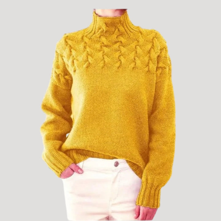 Soft women's high-neck cable knit sweater for spring, offering warmth without bulk for cool days.