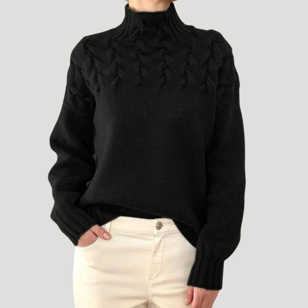 Elegant women's knitwear: a high-neck cable knit pullover designed for sophisticated spring outfits.