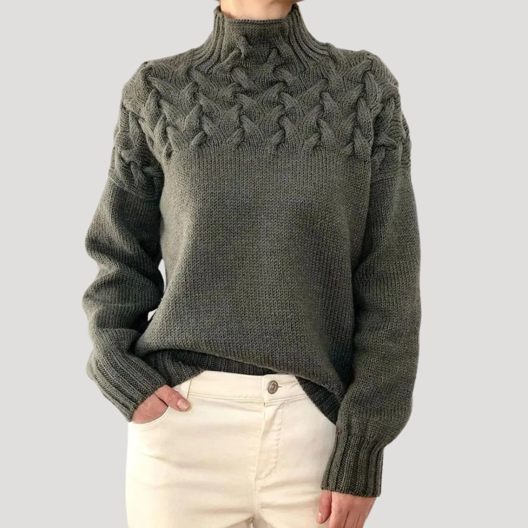 Fashionable women's spring sweater with a flattering high neck and detailed cable knit texture.