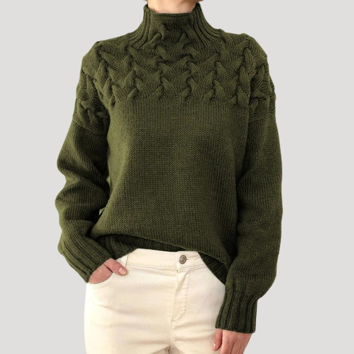 Classic high-neck cable knit pullover for women, showcasing a beautiful woven pattern for spring.