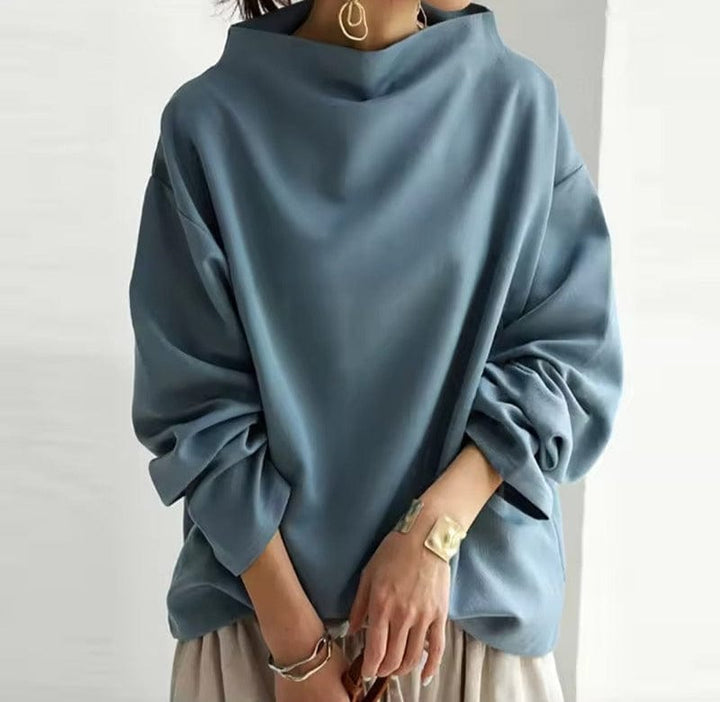 Versatile women's long-sleeve high-neck top, soft fabric, suitable for layering in cold weather.