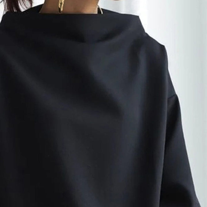 Elegant women's high-neck top with long sleeves, made from soft fabric for ultimate comfort.