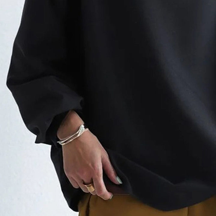 Soft fabric women's long-sleeve high-neck top, a must-have for winter fashion and layering.